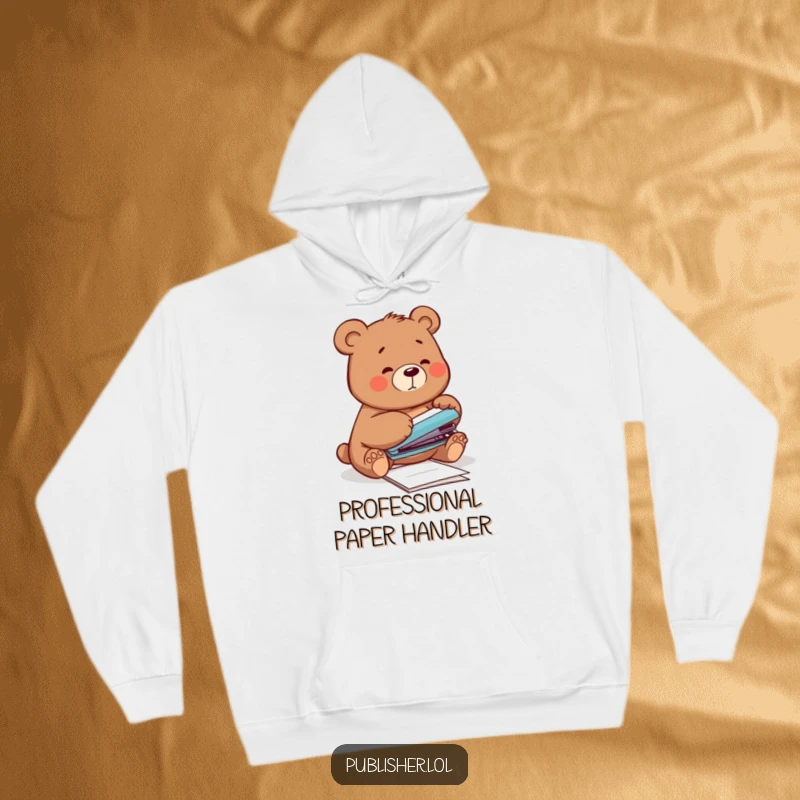 Funny Hoodie featuring a clumsy bear attempting to staple papers with its paw, offering cozy humor for those who embrace their mistakes.